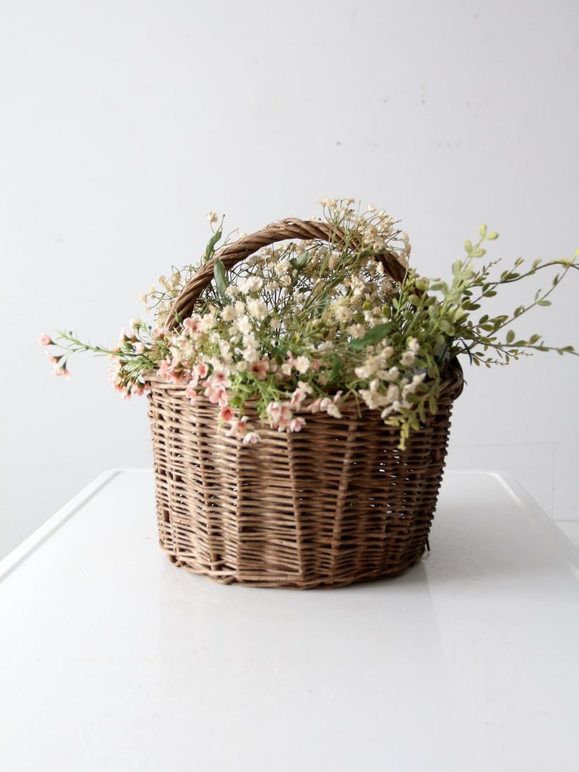 Rustic Vintage Wicker Basket with Twisted Handle 15x13.5x13.5: Rustic Vintage Wicker Basket with Twisted Handle 15x13.5x13.5 Enhance your home decor with this charming vintage wicker basket. Its rustic design features a twisted top handle, making it ideal for hol