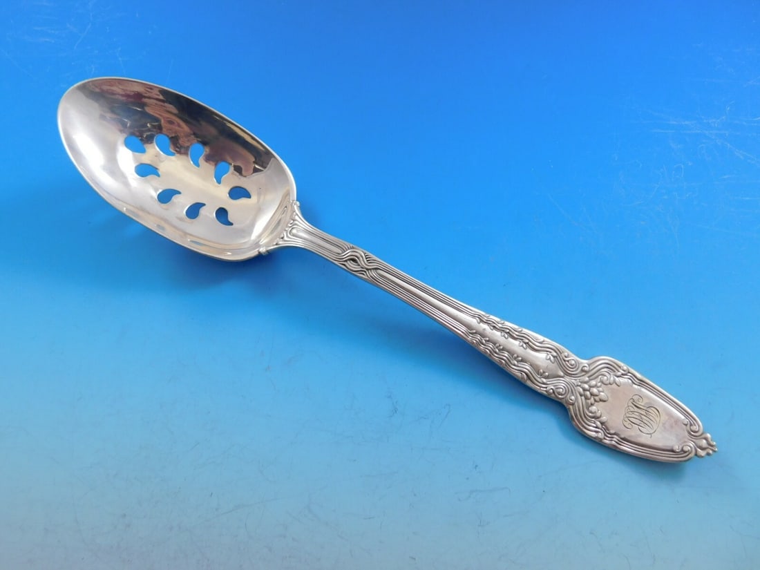 Tiffany & Co. Broom Corn Sterling Silver Serving Spoon Custom 9-Hole: Tiffany & Co. Broom Corn Sterling Silver Serving Spoon Custom 9-Hole This exquisite serving spoon from Tiffany & Co. features the elegant Broom Corn pattern, crafted from high-quality sterling silver.