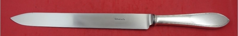 Tiffany & Co Reeded Edge Sterling Silver Roast Carving Knife 14 3/4": Tiffany & Co Reeded Edge Sterling Silver Roast Carving Knife 14 3/4" Enhance your dining experience with this exquisite Reeded Edge Roast Carving Knife by Tiffany & Co. Crafted from high-quality sterl