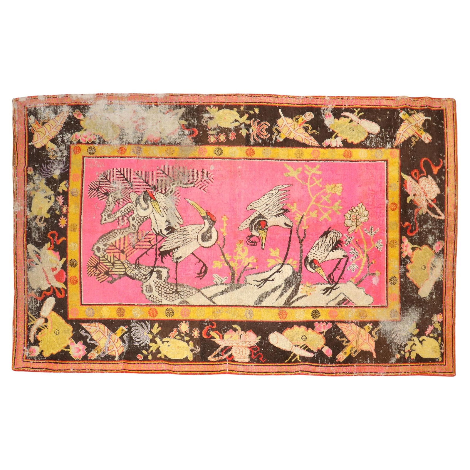 Antique 19th Century Khotan Rug with Flamingos 70 x 120 in: Antique 19th Century Khotan Rug with Flamingos 70 x 120 in Discover the charm of this late 19th-century Khotan rug, featuring a vibrant bright pink background adorned with four elegant flamingos. This