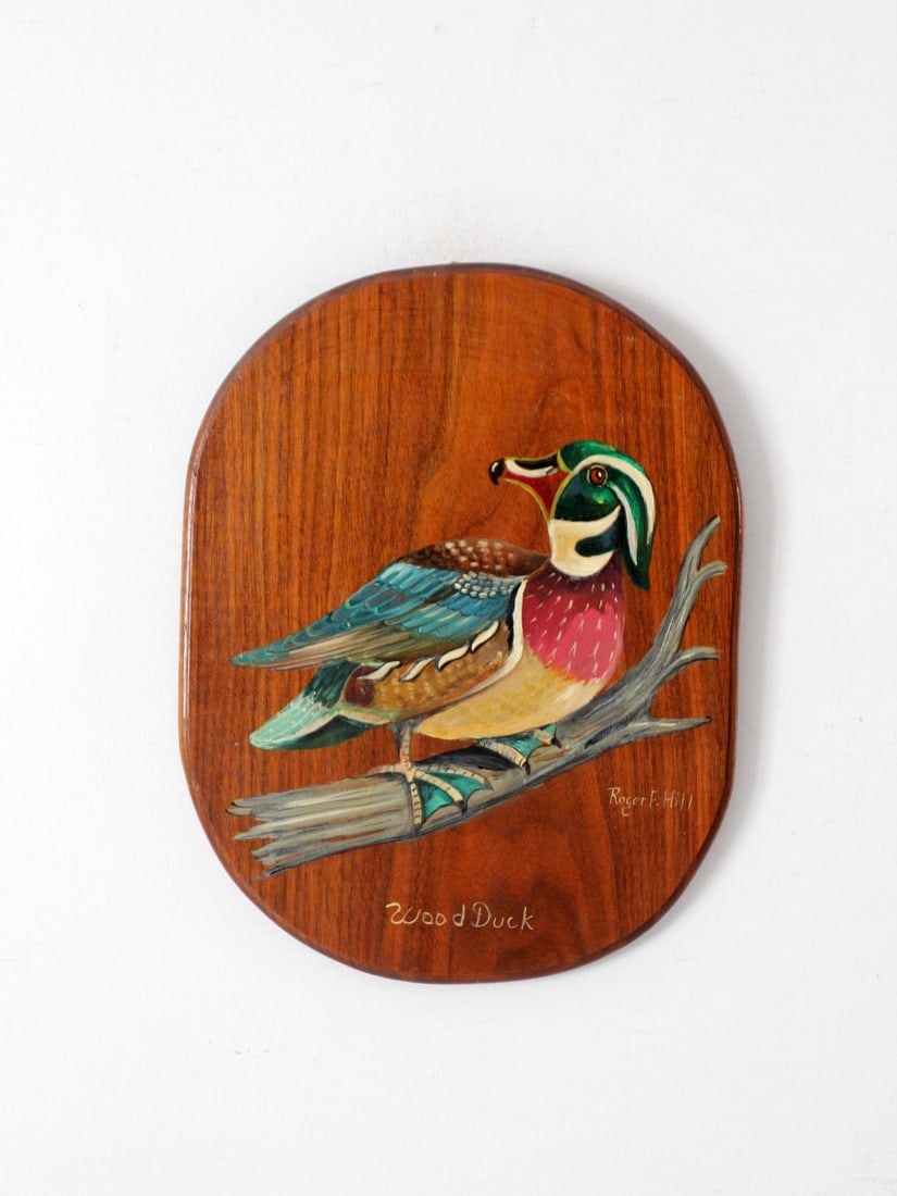 1984 Vintage Wood Duck Painting by Robert F. Hill: 1984 Vintage Wood Duck Painting by Robert F. Hill Add a touch of rustic charm to your home with this vintage wood duck painting on wood, created by Robert F. Hill in 1984. The artwork beautifully capt