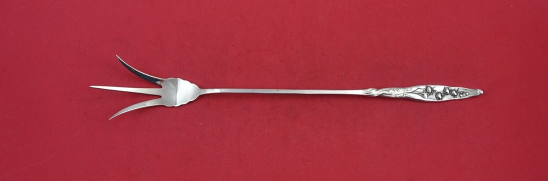 Whiting Sterling Silver Lily of the Valley Lettuce Fork 9 5/8": Whiting Sterling Silver Lily of the Valley Lettuce Fork 9 5/8" This exquisite serving fork, measuring 9 5/8 inches, showcases the elegant "Lily of the Valley" pattern by Whiting, crafted from high-qua