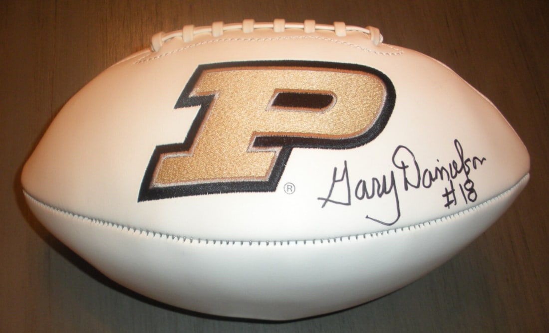 Gary Danielson Signed Purdue Boilermakers Football with COA Rare Collectible: Gary Danielson Signed Purdue Boilermakers Football with COA Rare Collectible This is a rare signed football featuring the autograph of Gary Danielson, a notable player of the Purdue Boilermakers. The