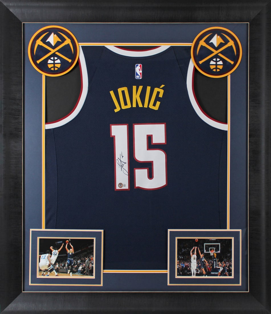 Nikola Jokic Signed Denver Nuggets Framed Jersey BAS Authentic: Nikola Jokic Signed Denver Nuggets Framed Jersey BAS Authentic Celebrate the legacy of Nikola Jokic with this autographed navy blue Nike Swingman jersey, beautifully framed to showcase your admiration