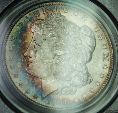 1890 Morgan Silver Dollar Coin PCGS MS-63 Toned Uncirculated: 1890 Morgan Silver Dollar Coin PCGS MS-63 Toned Uncirculated This 1890 Morgan Silver Dollar Coin is a stunning piece of numismatic history, certified by PCGS with a grade of MS-63. Struck at the Phila