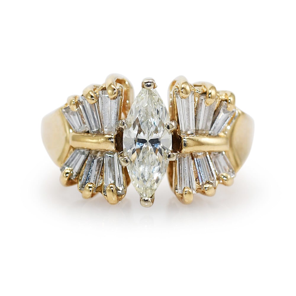 Vintage 14K Yellow Gold .65ct Marquise Diamond Ring Anniversary: Vintage 14K Yellow Gold .65ct Marquise Diamond Ring Anniversary This exquisite vintage ring features a stunning marquise diamond at its center, weighing .65 carats and showcasing a beautiful H - I col