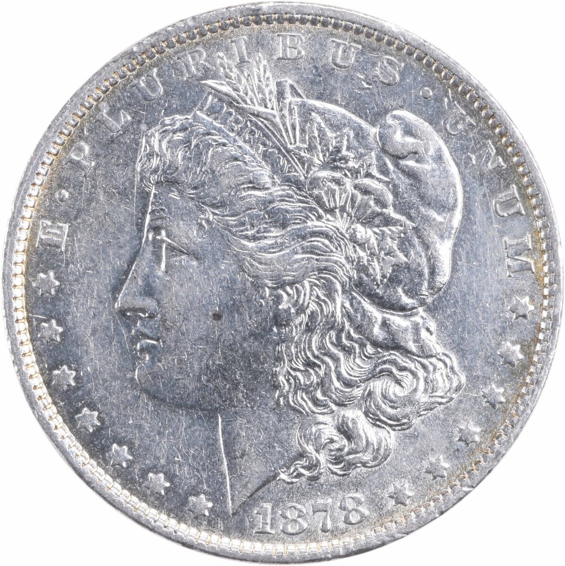 1878 Morgan Silver Dollar AU Uncertified Coin by George T. Morgan: 1878 Morgan Silver Dollar AU Uncertified Coin by George T. Morgan This 1878 Morgan Silver Dollar features a beautiful design by George T. Morgan, showcasing the classic profile of Lady Liberty. The co