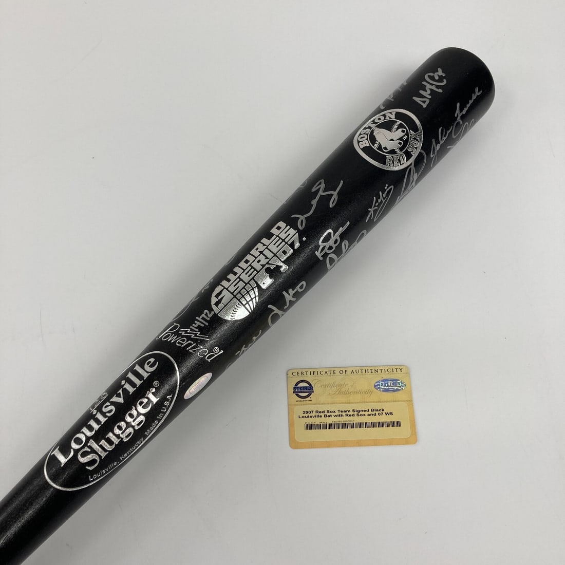 2007 Boston Red Sox Team Signed Bat with Steiner COA and Beckett Authentication: 2007 Boston Red Sox Team Signed Bat with Steiner COA and Beckett Authentication Celebrate the legacy of the 2007 Boston Red Sox with this commemorative Louisville Slugger baseball bat, signed by 14 me
