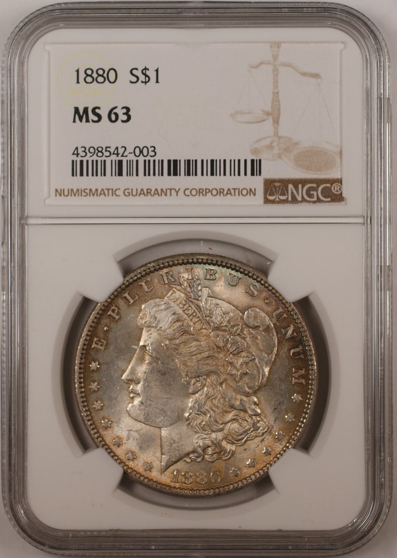 1880 NGC MS-63 Morgan Silver Dollar Coin Toned Uncirculated: 1880 NGC MS-63 Morgan Silver Dollar Coin Toned Uncirculated This 1880 Morgan Silver Dollar Coin is a stunning piece certified by NGC with a grade of MS-63, indicating its uncirculated condition. Minte