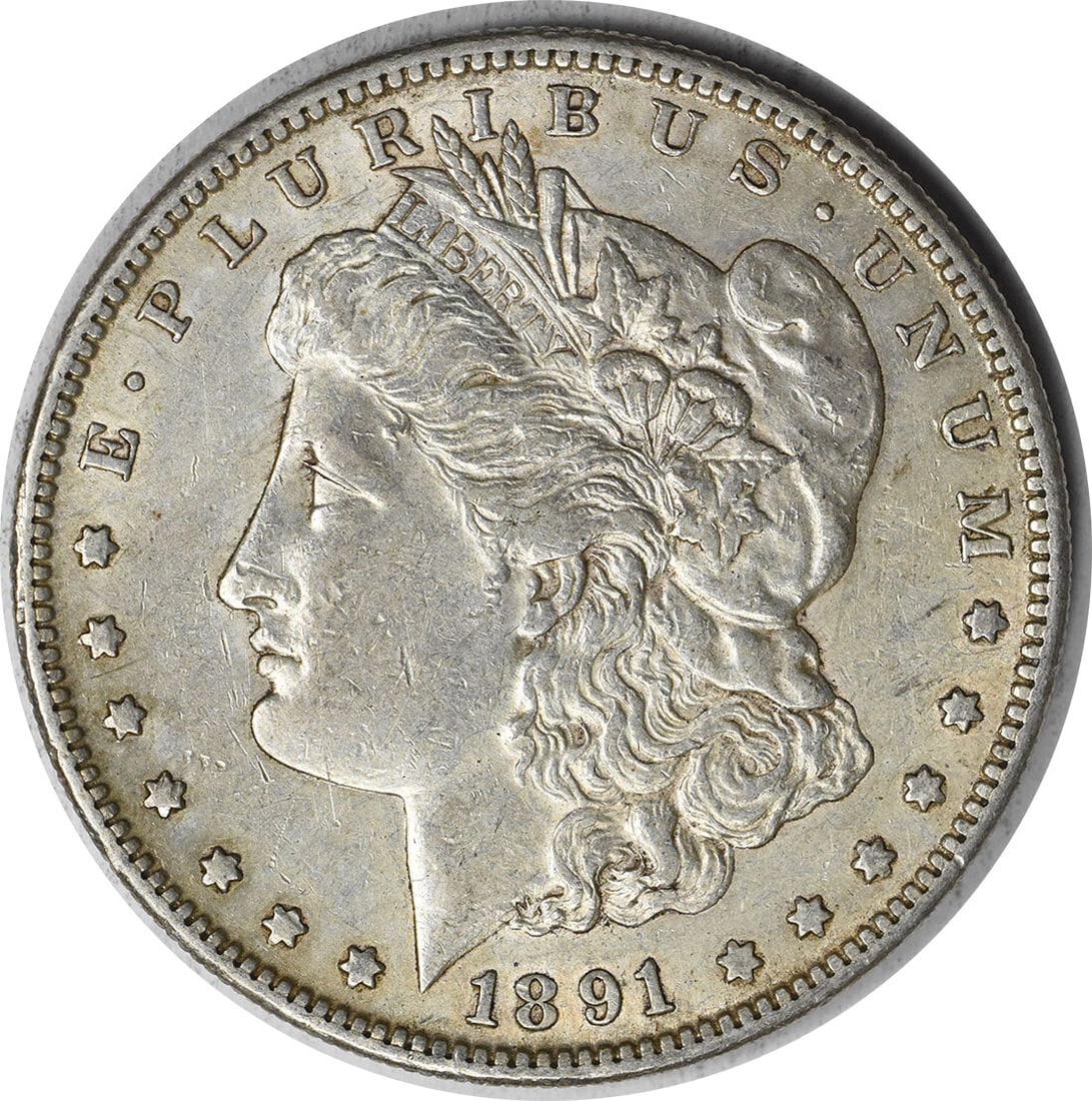 1891-S Morgan Silver Dollar AU Uncertified San Francisco Coin: 1891-S Morgan Silver Dollar AU Uncertified San Francisco Coin This 1891-S Morgan Silver Dollar is a beautiful piece of numismatic history, showcasing the artistry of designer George T. Morgan. The coi