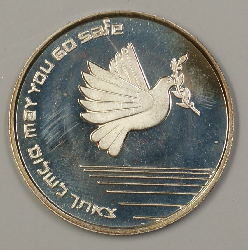 1985 Israel Silver Proof Medal May You Go and Return in Peace with COA: 1985 Israel Silver Proof Medal May You Go and Return in Peace with COA This 1985 silver proof medal from Israel is titled "May You Go and Return in Peace". It is an uncirculated piece, ensuring its pr