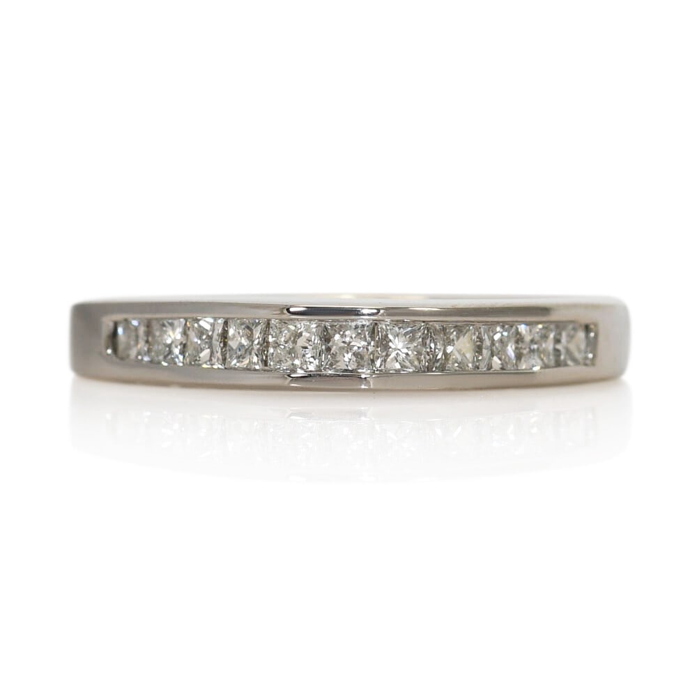 Elegant 14K White Gold Princess Cut Diamond Band with 11 Diamonds: Elegant 14K White Gold Princess Cut Diamond Band with 11 Diamonds This elegant 14K White Gold Diamond Band is the perfect choice for a wedding or anniversary. Crafted from high-quality white gold, thi