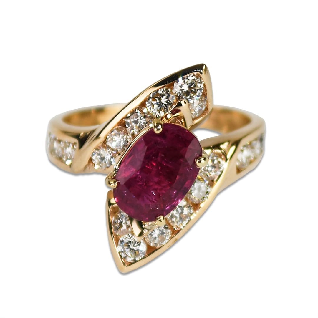 14K Yellow Gold GIA Certified 1.94ct Ruby Diamond Cluster Ring: 14K Yellow Gold GIA Certified 1.94ct Ruby Diamond Cluster Ring This exquisite 14K yellow gold ring features a stunning GIA certified ruby and diamond setting. The centerpiece is an oval-shaped ruby we