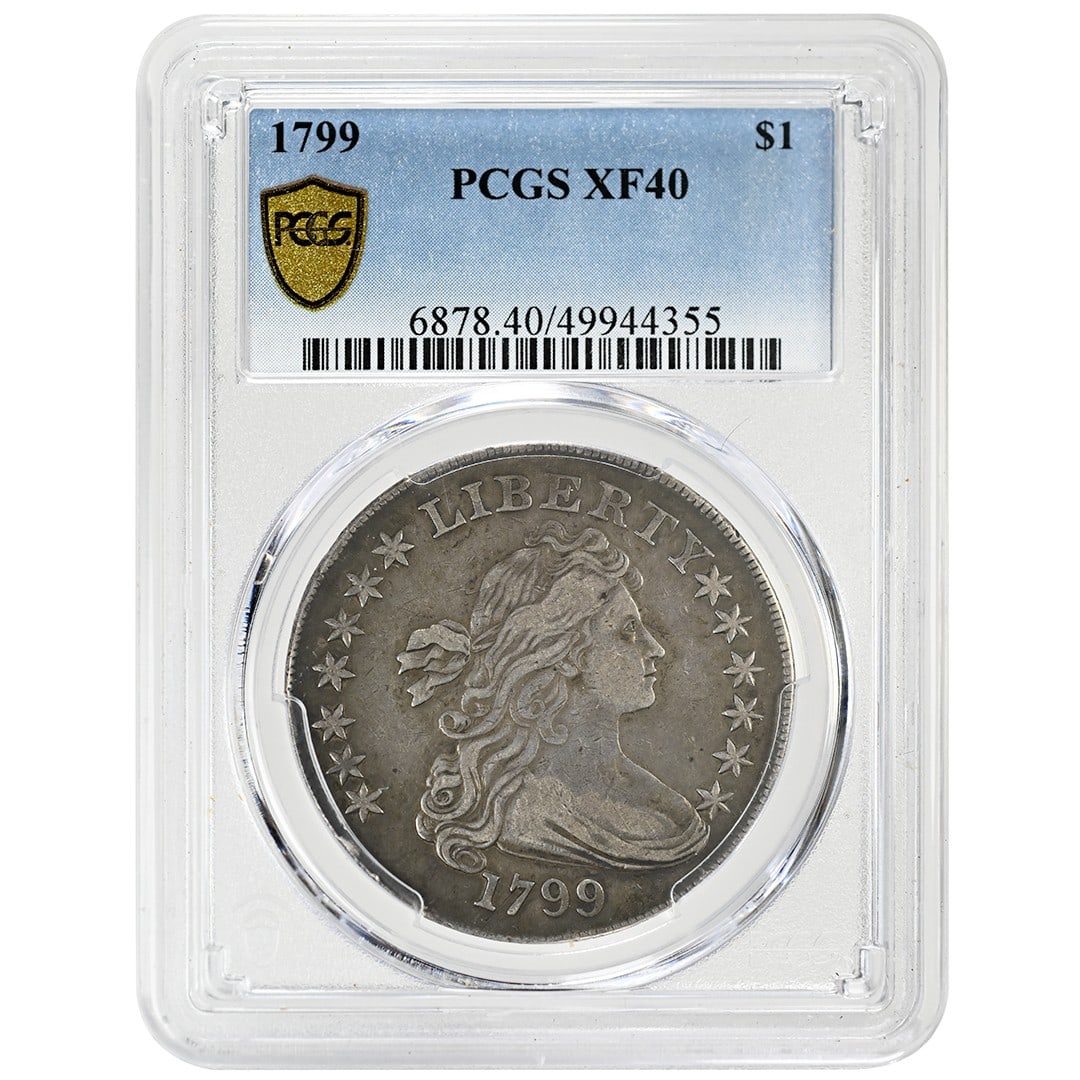 1799 Draped Bust Silver Dollar Type 2 Heraldic Eagle PCGS XF40: 1799 Draped Bust Silver Dollar Type 2 Heraldic Eagle PCGS XF40 This 1799 Draped Bust Dollar is a rare silver coin graded XF40 by PCGS. Featuring the Type 2 Heraldic Eagle, BB-151 Irregular Date with 1