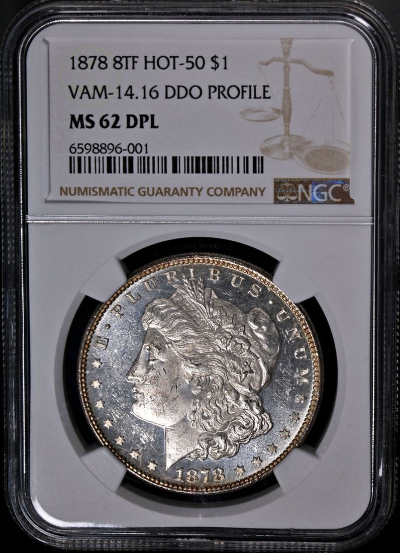 1878-P Morgan Silver Dollar Wild Lips VAM 14.16 NGC MS62 DPL: 1878-P Morgan Silver Dollar Wild Lips VAM 14.16 NGC MS62 DPL This 1878-P 8TF Morgan Silver Dollar, known for its 'Wild Lips' feature, is a remarkable collectible with outstanding eye appeal, showcasin
