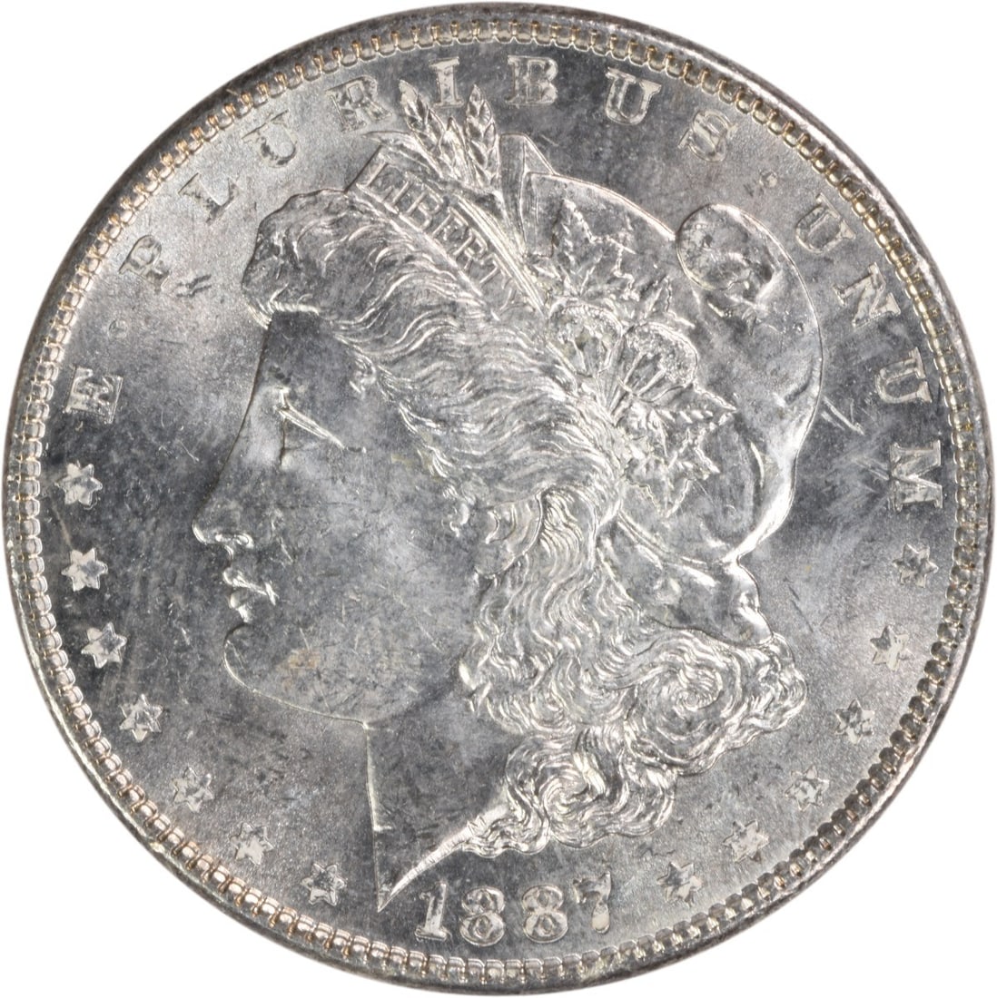 1887 Morgan Silver Dollar Choice BU Uncertified Silver Coin: 1887 Morgan Silver Dollar Choice BU Uncertified Silver Coin This 1887 Morgan Silver Dollar is a stunning example of numismatic artistry, showcasing a Choice BU grade. Struck in silver without a mint m
