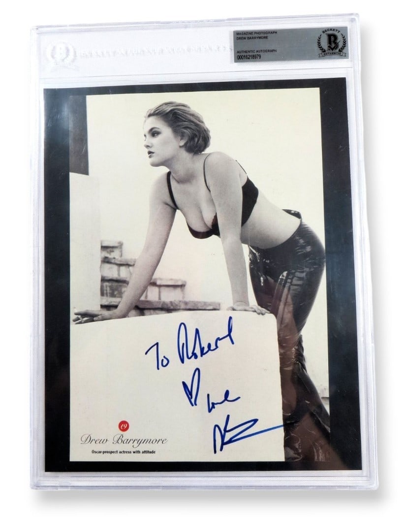 Drew Barrymore Autographed 8X10 Vintage Photo Beckett Authenticated: Drew Barrymore Autographed 8X10 Vintage Photo Beckett Authenticated This is an original black and white photograph of Drew Barrymore, measuring 8" x 10". It features a signed autograph, which has been
