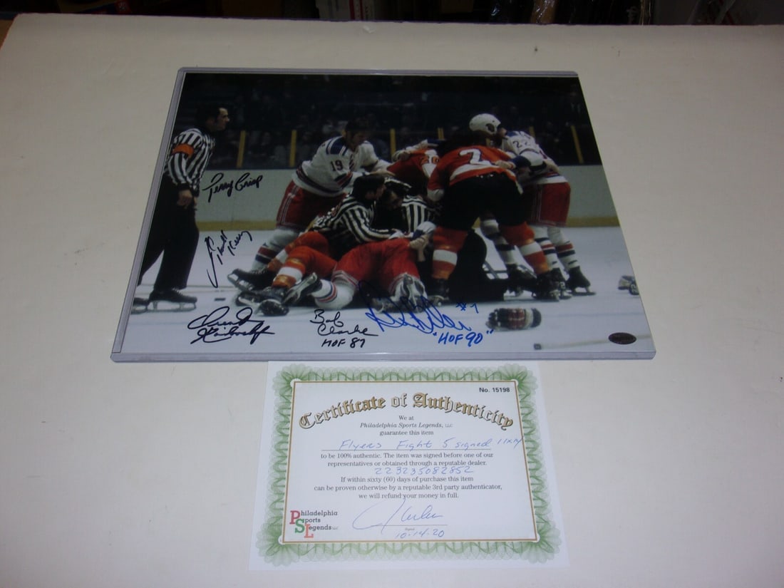 Bob Clarke Bill Barber Philadelphia Flyers Fighting 5 Signed 11x14 Photo with COA: Bob Clarke Bill Barber Philadelphia Flyers Fighting 5 Signed 11x14 Photo with COA This is an original 11x14 photograph featuring Bob Clarke and Bill Barber of the Philadelphia Flyers, celebrating thei