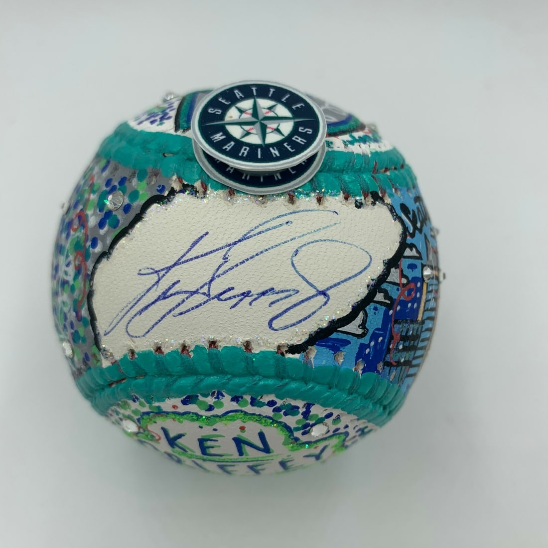 Ken Griffey Jr Signed Fazzino Art Baseball with Steiner COA: Ken Griffey Jr Signed Fazzino Art Baseball with Steiner COA This unique baseball features a hand-painted design by renowned artist Charles Fazzino, making it a true collector's item. It showcases Ken
