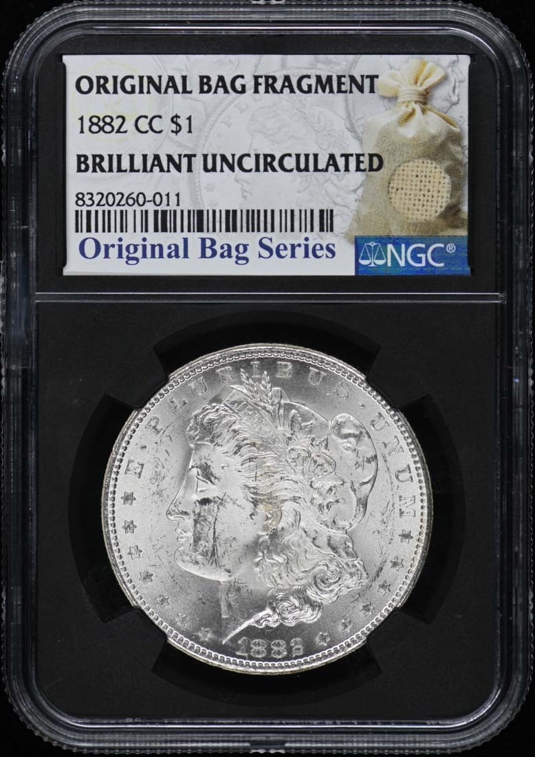 1882-CC Morgan Dollar NGC MS60 Uncirculated Coin: 1882-CC Morgan Dollar NGC MS60 Uncirculated Coin This 1882-CC Morgan Dollar is a remarkable piece of numismatic history, showcasing a stunning uncirculated condition. Certified by NGC with a grade of