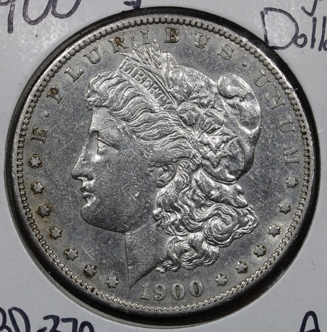 1900-S Morgan Silver Dollar $1 Scarce Date Uncertified: 1900-S Morgan Silver Dollar $1 Scarce Date Uncertified This 1900-S Morgan Silver Dollar is a notable addition for any coin collector. Featuring a denomination of $1, this coin is made of silver with a