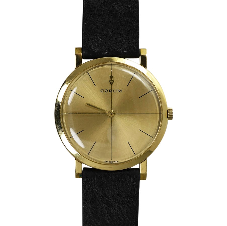 Vintage Corum 18K Yellow Gold Manual Wind Luxury Watch: Vintage Corum 18K Yellow Gold Manual Wind Luxury Watch This exquisite vintage Corum wristwatch boasts a stylish 18K yellow gold case that is both luxurious and elegant. Featuring a manual wind 17 jewe
