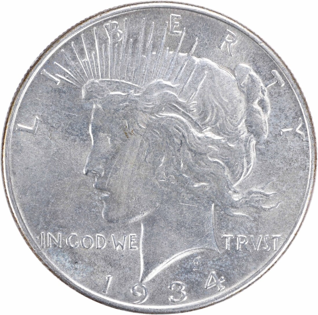 1934 Peace Silver Dollar AU Uncertified 90% Silver Coin: 1934 Peace Silver Dollar AU Uncertified 90% Silver Coin This 1934 Peace Silver Dollar showcases a beautiful design by Anthony de Francisci. Crafted in Philadelphia, this coin is composed of 90% silver