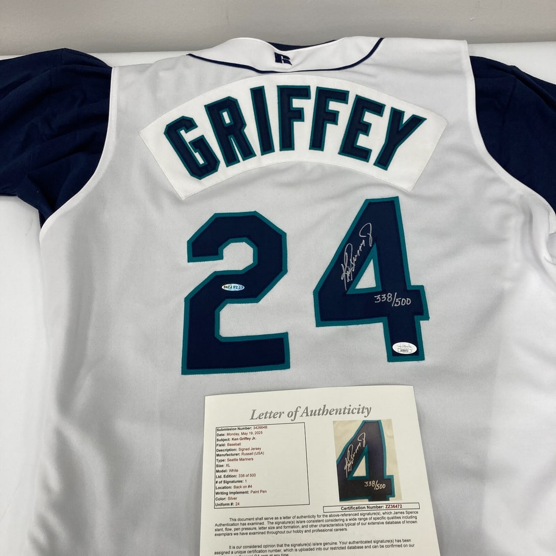 Ken Griffey Jr. Signed 1990s Mariners Jersey with JSA Authentication: Ken Griffey Jr. Signed 1990s Mariners Jersey with JSA Authentication Own a piece of baseball history with this authentic 1990's Seattle Mariners jersey signed by the legendary Ken Griffey Jr. This ori