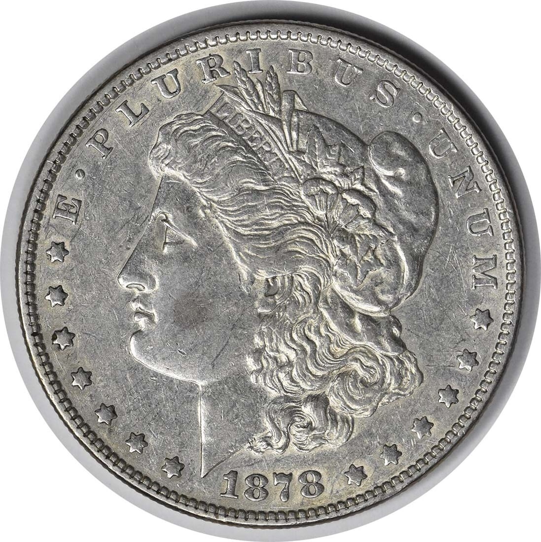 1878 Morgan Silver Dollar AU Uncertified Triple Blossom George T. Morgan: 1878 Morgan Silver Dollar AU Uncertified Triple Blossom George T. Morgan This 1878 Morgan Silver Dollar features the classic design by George T. Morgan. With a composition of 90% silver and 10% copper