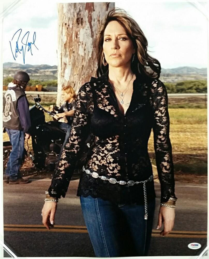 Katey Sagal Signed 16x20 Photo Gemma SOA PSA/DNA Autograph: Katey Sagal Signed 16x20 Photo Gemma SOA PSA/DNA Autograph This is a signed 16x20 photo of Katey Sagal, known for her role as Gemma in the television series Sons of Anarchy. The photo is an original p