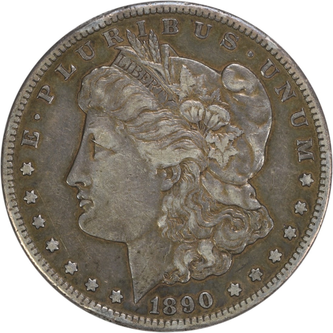 1890-CC Morgan Silver Dollar VF Uncertified 90% Silver Coin: 1890-CC Morgan Silver Dollar VF Uncertified 90% Silver Coin This 1890-CC Morgan Silver Dollar showcases a classic design by George T. Morgan, representing a significant piece of numismatic history. Th