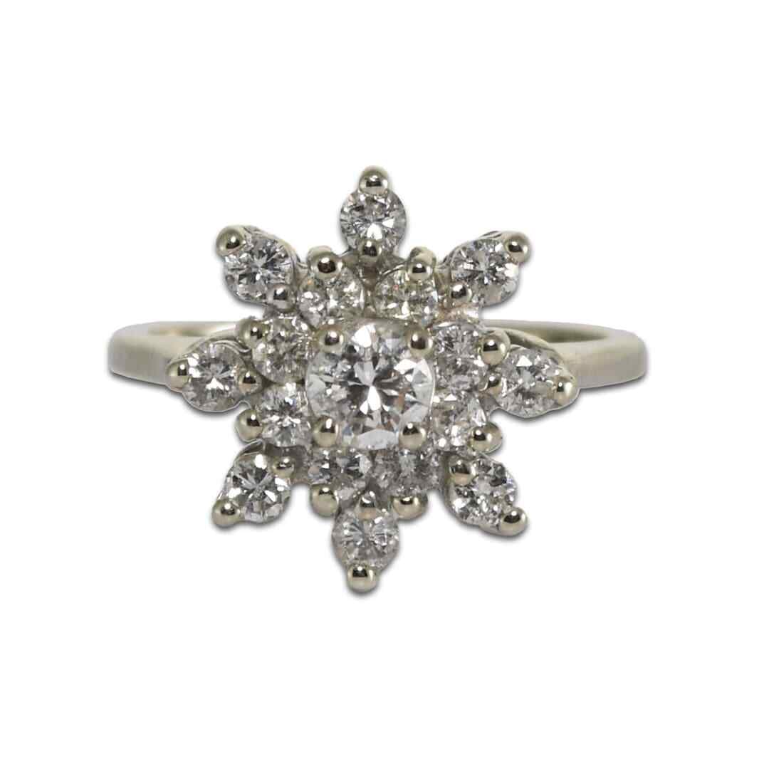 Stunning 14K White Gold Diamond Cluster Ring 0.65ct Size 6: Stunning 14K White Gold Diamond Cluster Ring 0.65ct Size 6 This stunning 14K white gold diamond cluster ring features a captivating arrangement of diamonds, weighing a total of 0.65 carats. The ring s