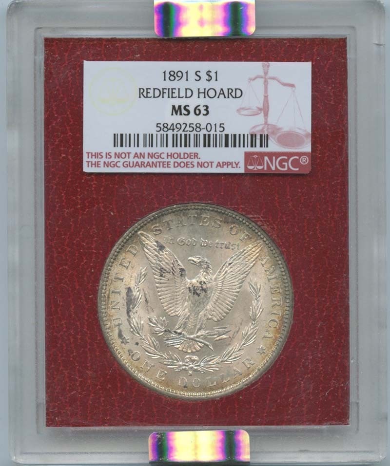 1891-S Morgan Dollar NGC MS63 Redfield Collection Uncirculated: 1891-S Morgan Dollar NGC MS63 Redfield Collection Uncirculated This 1891-S Morgan Dollar is a stunning piece from the Redfield Collection, boasting a high-grade certification by NGC. Graded MS63, it r