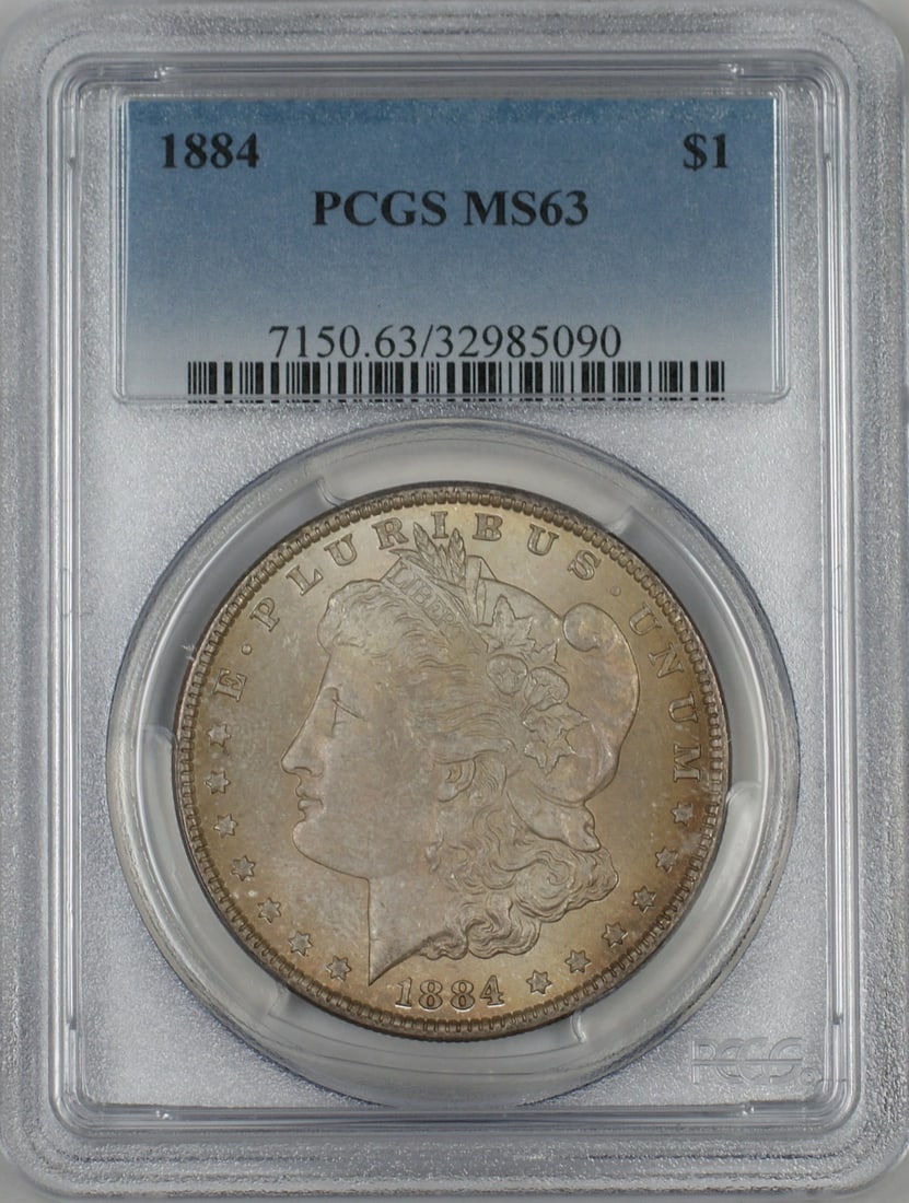 1884 Morgan Silver Dollar PCGS MS-63 Toned Coin: 1884 Morgan Silver Dollar PCGS MS-63 Toned Coin This 1884 Morgan Silver Dollar is a stunning piece graded MS 63 by PCGS. Struck in Philadelphia, this uncirculated coin showcases the classic design tha