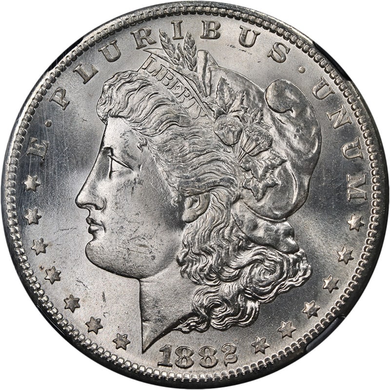 1882-S Morgan Silver Dollar NGC MS65 25th Anniversary Blast White: 1882-S Morgan Silver Dollar NGC MS65 25th Anniversary Blast White This stunning 1882-S Morgan Silver Dollar is certified by NGC with a grade of MS65, showcasing remarkable eye appeal and outstanding l