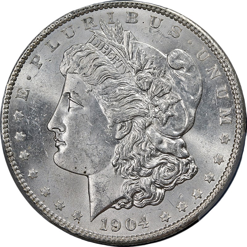 1904-P Morgan Silver Dollar PCGS MS63 Stunning Blast White Coin: 1904-P Morgan Silver Dollar PCGS MS63 Stunning Blast White Coin This 1904-P Morgan Silver Dollar, certified by PCGS with a grade of MS63, showcases exceptional eye appeal with its blast white finish a