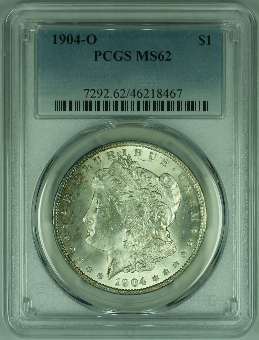 1904-O Morgan Silver Dollar PCGS MS62 Uncirculated Silver Coin: 1904-O Morgan Silver Dollar PCGS MS62 Uncirculated Silver Coin This 1904-O Morgan Silver Dollar is a stunning example of American coinage, featuring a classic design that has captured the hearts of co