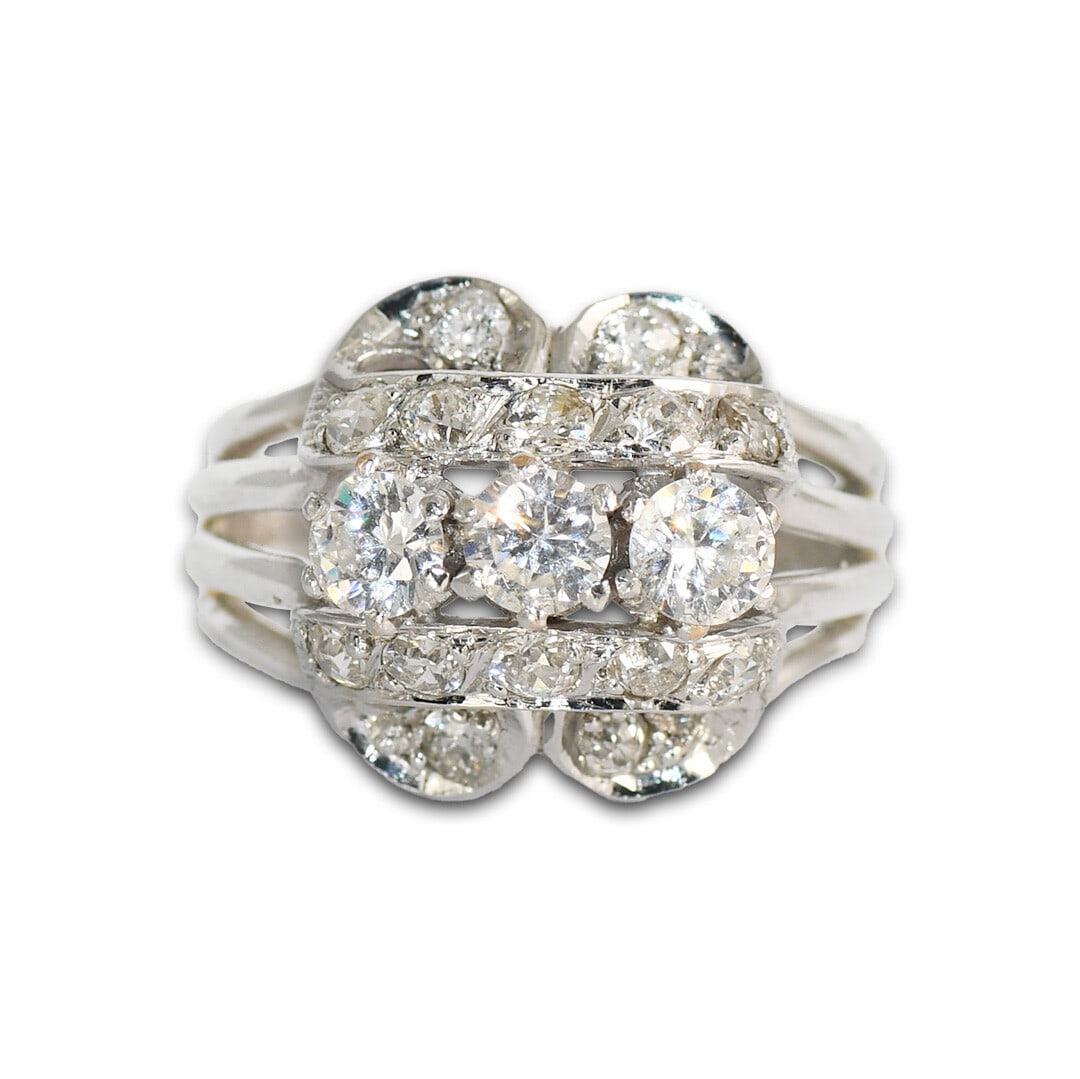 Vintage 17K White Gold Cluster Ring with Diamond and Cubic Zirconia: Vintage 17K White Gold Cluster Ring with Diamond and Cubic Zirconia This stunning vintage ring features a cluster setting crafted from 17K white gold. Weighing 8.4 grams, it showcases three center sto