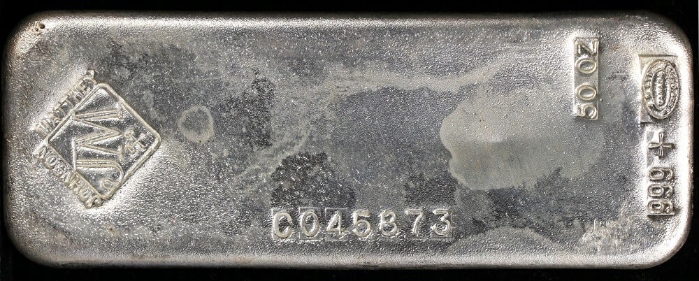 50 oz Poured Silver Bar by Johnson Matthey .999 Fine Vintage: 50 oz Poured Silver Bar by Johnson Matthey .999 Fine Vintage This vintage Johnson Matthey poured silver bar weighs 50 ounces and is composed of .999 fine silver. It is pre-owned and originates from th