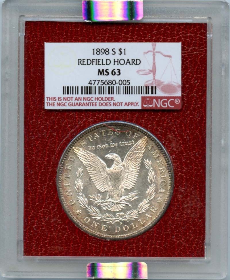 1898-S Morgan Dollar NGC MS63 Redfield Hoard Uncirculated: 1898-S Morgan Dollar NGC MS63 Redfield Hoard Uncirculated This 1898-S Morgan Dollar is a remarkable piece from the Redfield Hoard, certified by NGC with a grade of MS63, indicating its uncirculated co