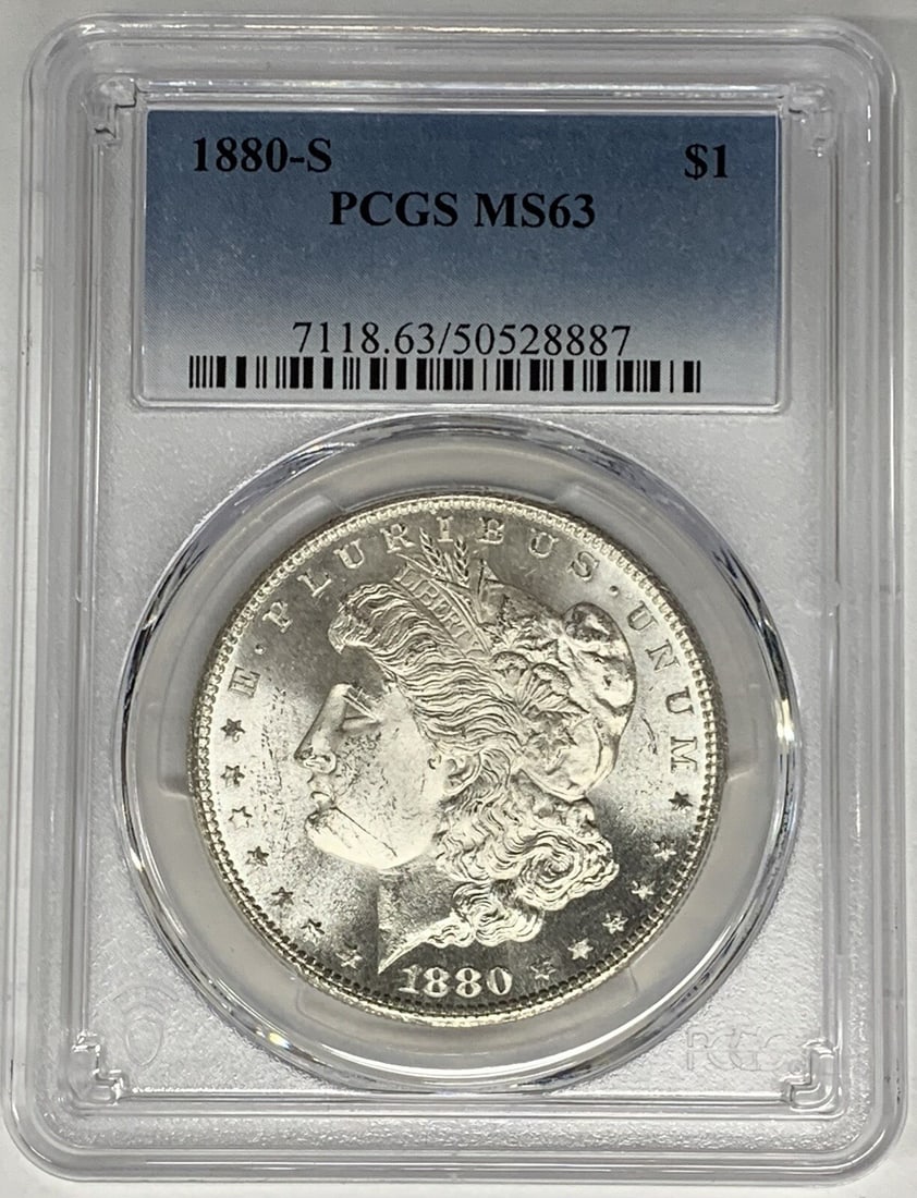1880-S Morgan Silver Dollar PCGS MS 63 Uncirculated Silver Coin: 1880-S Morgan Silver Dollar PCGS MS 63 Uncirculated Silver Coin This 1880-S Morgan Silver Dollar is a remarkable addition to any numismatic collection. Featuring a denomination of $1, this coin is mad