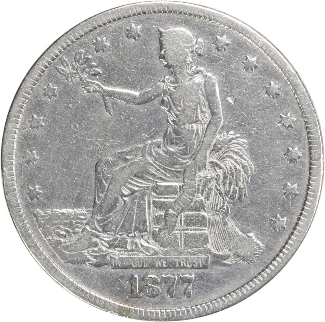 1877 Trade Silver Dollar VF Uncertified William Barber Design: 1877 Trade Silver Dollar VF Uncertified William Barber Design This 1877 Trade Silver Dollar features a classic design by William Barber, representing a significant piece of numismatic history. Struck