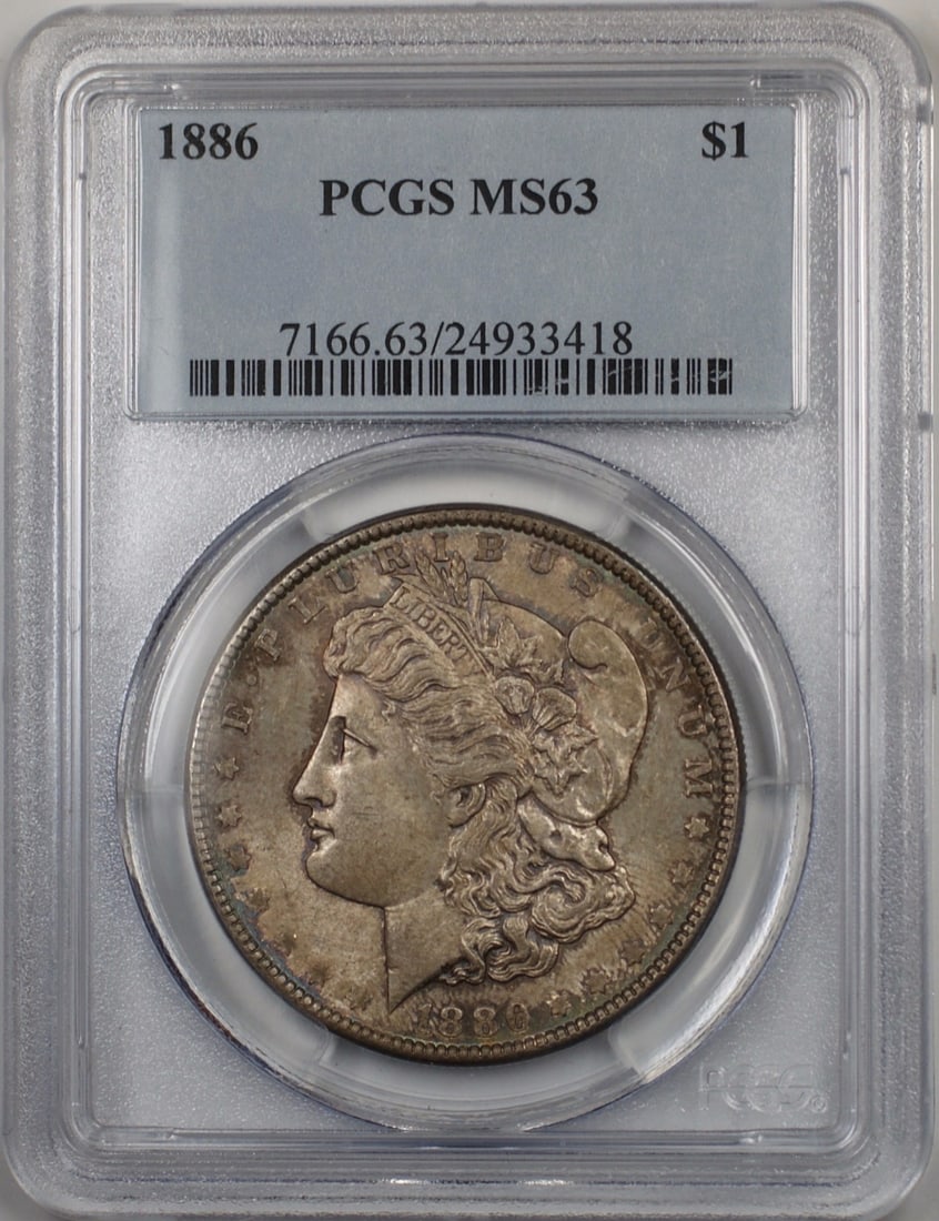 1886 Morgan Silver Dollar PCGS MS63 Toned Coin: 1886 Morgan Silver Dollar PCGS MS63 Toned Coin This 1886 Morgan Silver Dollar is a stunning example of American coinage, certified by PCGS with a grade of MS 63. Struck in Philadelphia, this uncircula