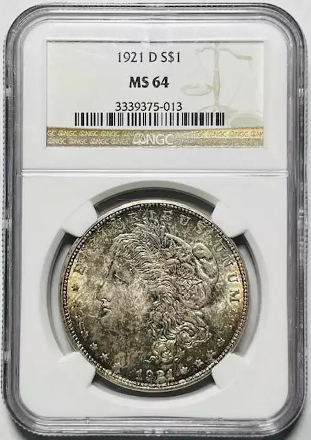 1921 D Morgan Silver Dollar NGC MS 64 Uncirculated: 1921 D Morgan Silver Dollar NGC MS 64 Uncirculated This 1921 D Morgan Silver Dollar is graded MS-64 by NGC, indicating it is in uncirculated condition. It features a beautiful silver composition and w