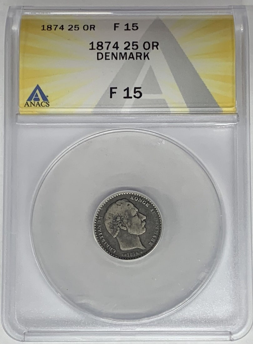 1874 Denmark 25 Ore Silver Coin ANACS F 15: 1874 Denmark 25 Ore Silver Coin ANACS F 15 This is a 25 Ore coin from Denmark, minted in 1874. The coin is composed of silver and has been graded as F 15 by ANACS. It is a pre-owned item, showcasing a