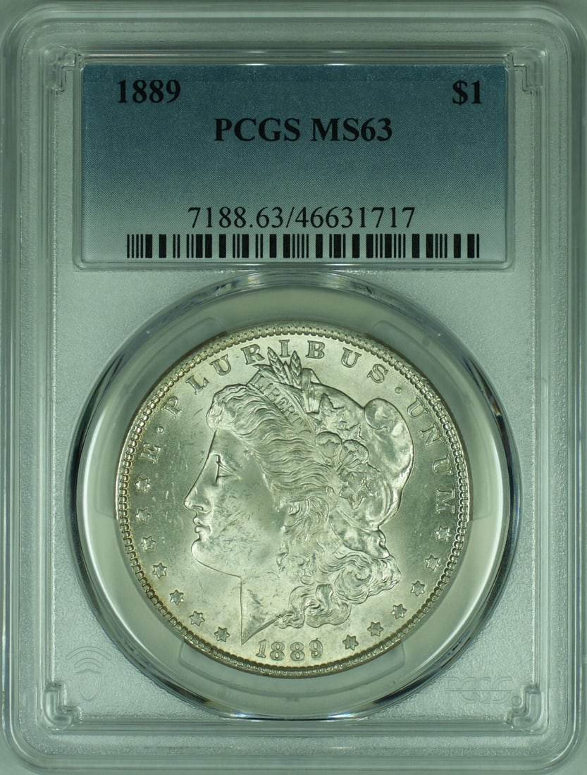 1889 Morgan Silver Dollar Coin PCGS MS63 Uncirculated Silver: 1889 Morgan Silver Dollar Coin PCGS MS63 Uncirculated Silver This 1889 Morgan Silver Dollar is a stunning example of American coinage, featuring a design that has become iconic. This uncirculated coin
