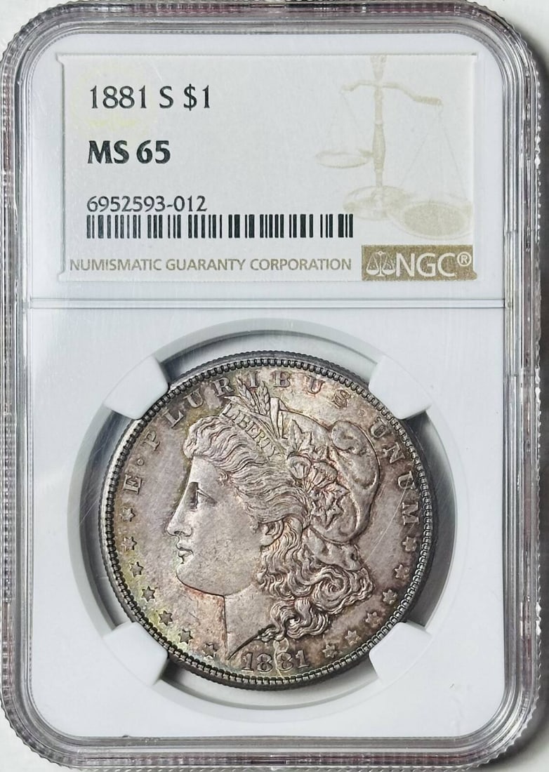 1881 S Morgan Silver Dollar NGC MS 65 Rainbow Toning Uncirculated: 1881 S Morgan Silver Dollar NGC MS 65 Rainbow Toning Uncirculated This stunning 1881 S Morgan Silver Dollar is graded MS-65 by NGC, showcasing beautiful rainbow toning that adds to its visual appeal.