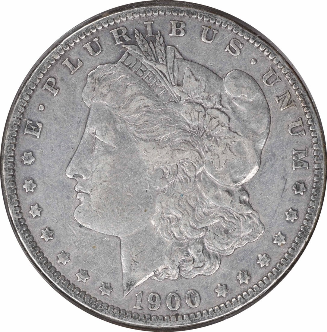 1900-O Morgan Silver Dollar 90% Silver VF Uncertified Coin: 1900-O Morgan Silver Dollar 90% Silver VF Uncertified Coin This 1900-O/CC Morgan Silver Dollar is a historically significant coin, featuring a striking design by George T. Morgan. It is in a Choice VF