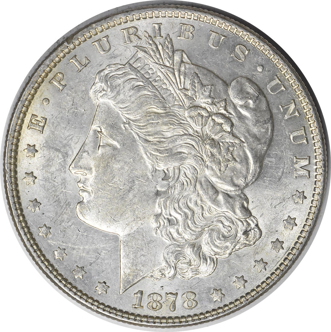 1878 Morgan Silver Dollar AU Uncertified 90% Silver Coin: 1878 Morgan Silver Dollar AU Uncertified 90% Silver Coin This 1878 Morgan Silver Dollar features a classic design by George T. Morgan. It is composed of 90% silver and 10% copper, minted in Philadelph