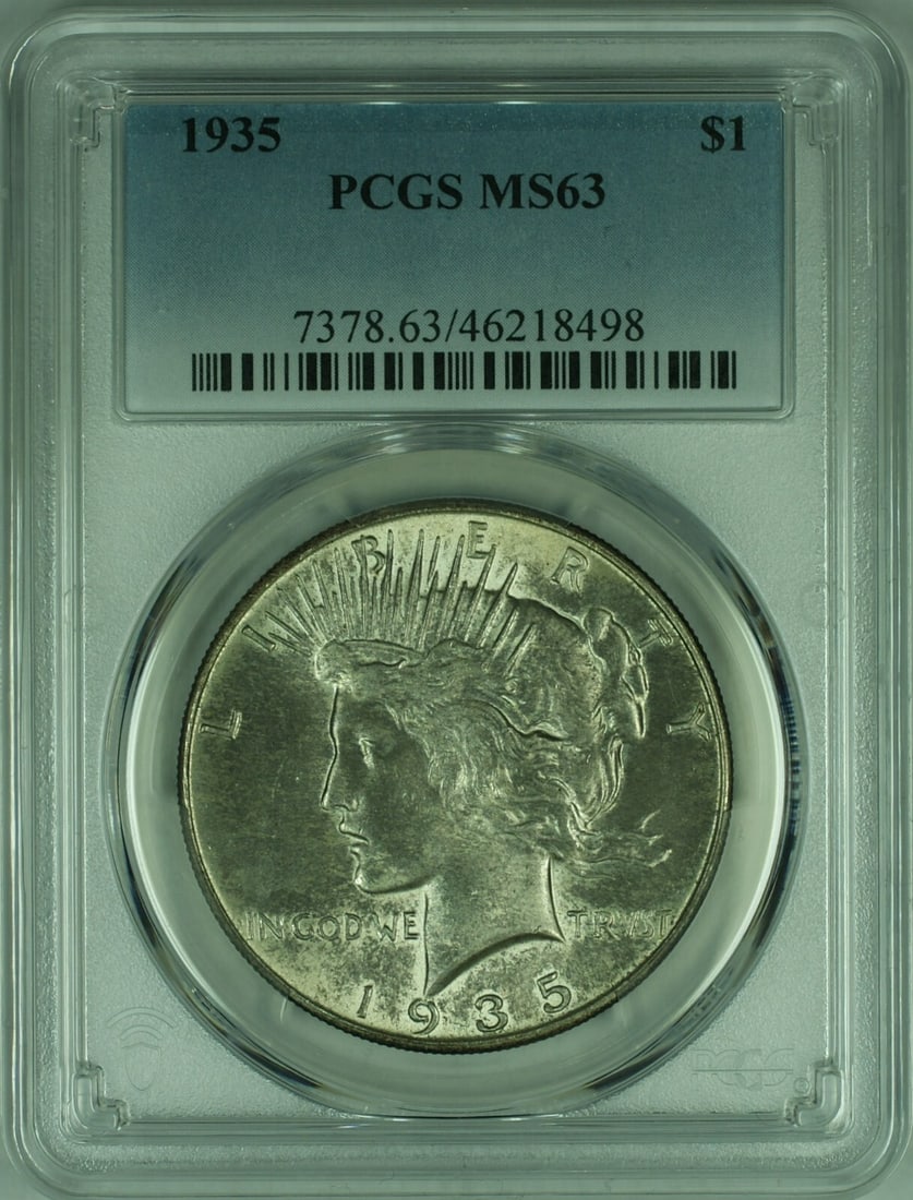 1935 Peace Silver Dollar PCGS MS-63 Toned Philadelphia Mint: 1935 Peace Silver Dollar PCGS MS-63 Toned Philadelphia Mint This 1935 Peace Silver Dollar is an exquisite piece of numismatic history, graded as MS-63 by PCGS. It features a stunning silver compositio